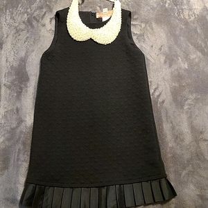 2 piece Black dress with pearls collar.